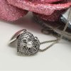 Pendente a cuore apribile con perla coltivata e marcassiti griffate, corredato di catena brunita e diamantata.  PD0465 - immagine 2