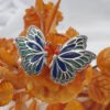 Orecchini farfalle smaltate con marcassiti griffate. OD2409